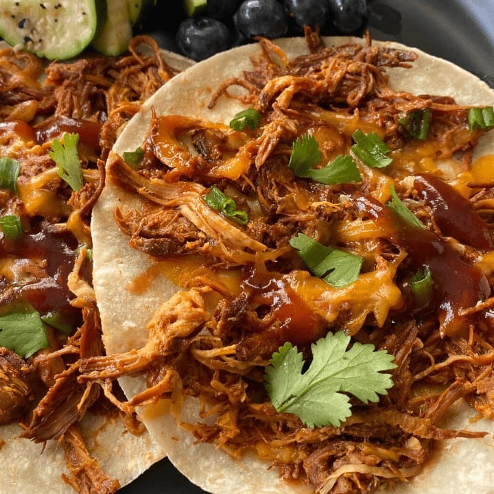 shredded BBQ chicken on a tortilla