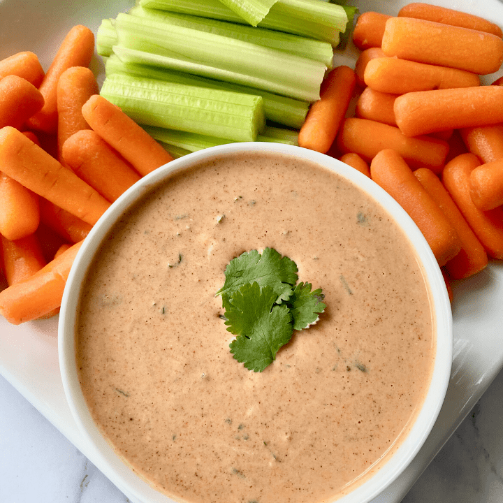 creamy salsa dip with carrots and celery