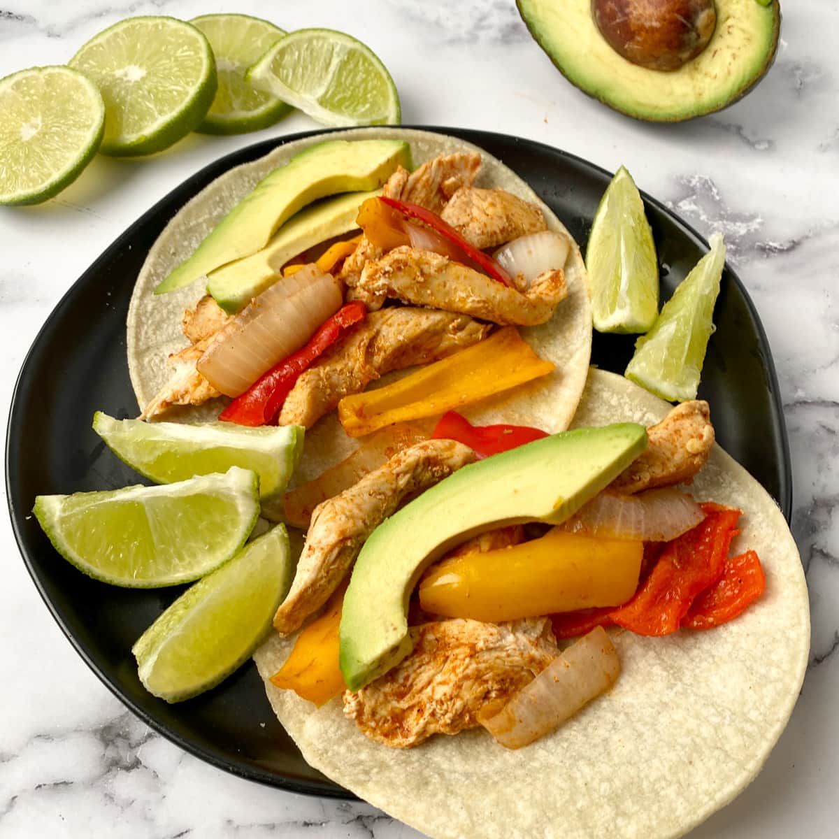 healthy Instant Pot Chicken Fajitas on corn tortillas