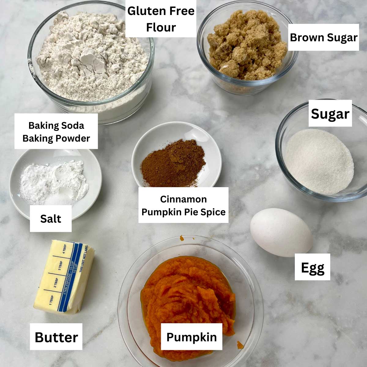 ingredients for gf pumpkin cookies labeled and sitting on a counter. 