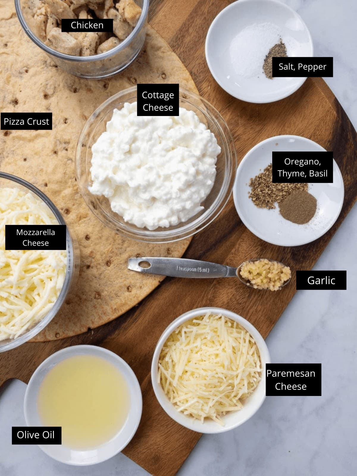 cottage-cheese-pizza-ingredients sitting on a cutting board.