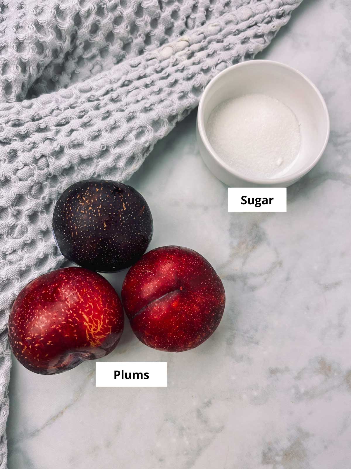 plum juice ingredients sitting on a counter and labeled.