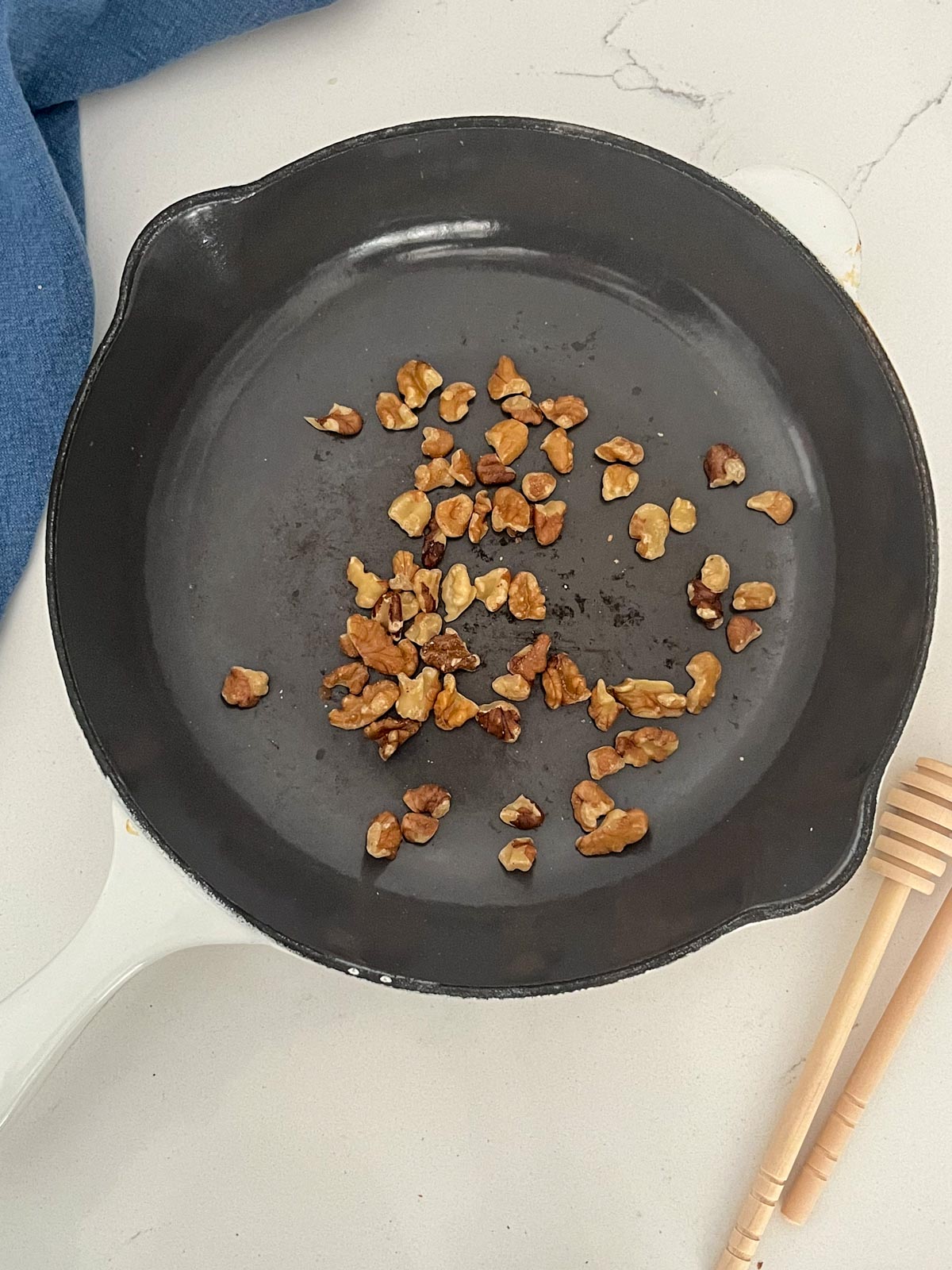 toasted walnuts in a frying pan