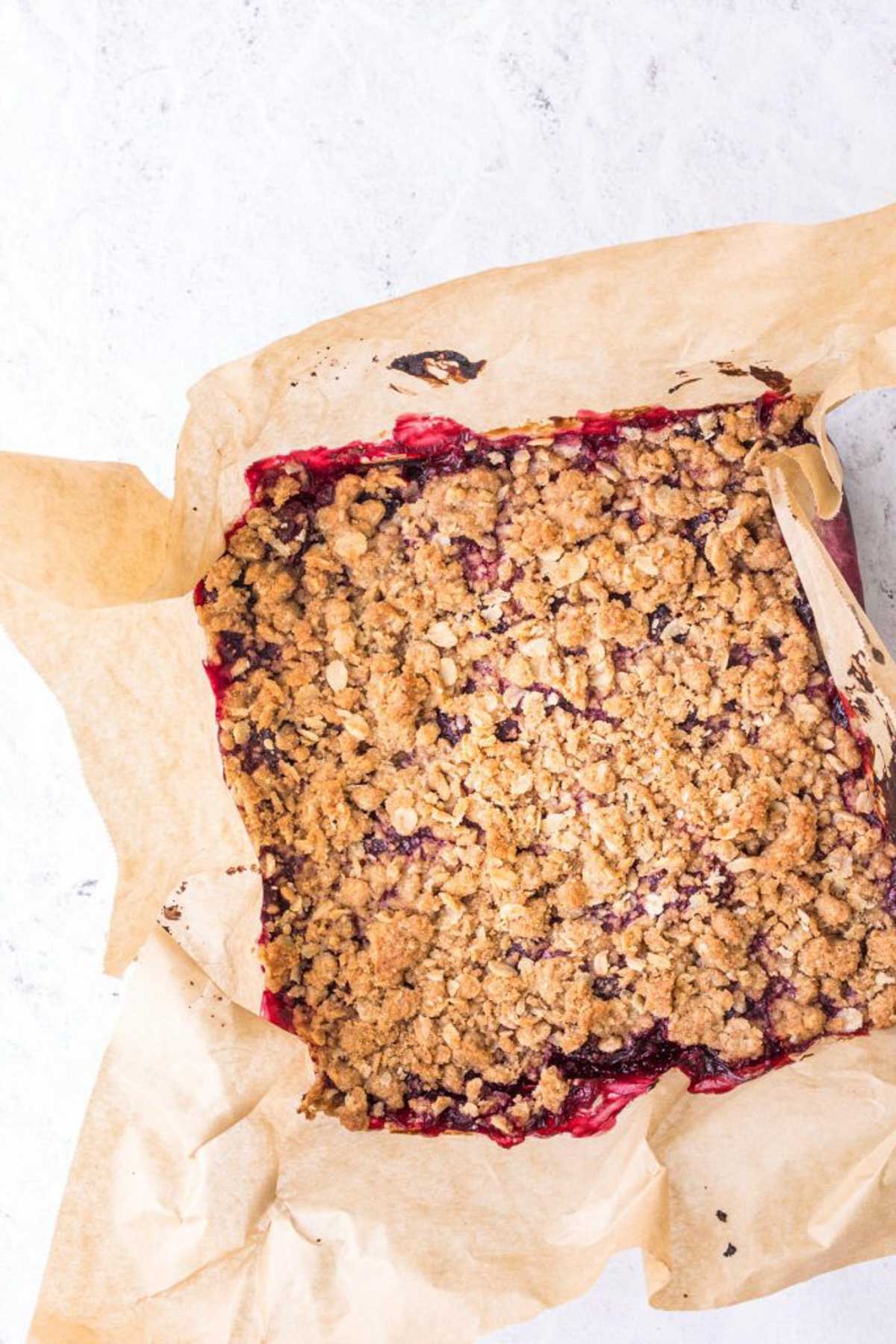 oatmeal cherry bars in a pan uncut.