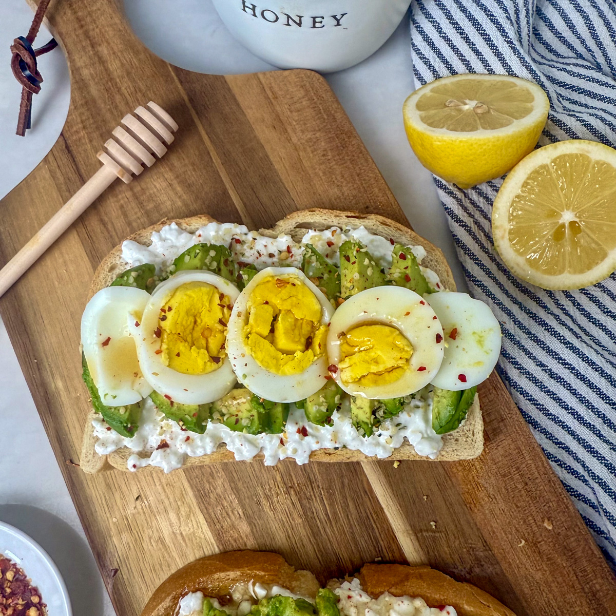 cottage cheese toast topped with hard boiled eggs
